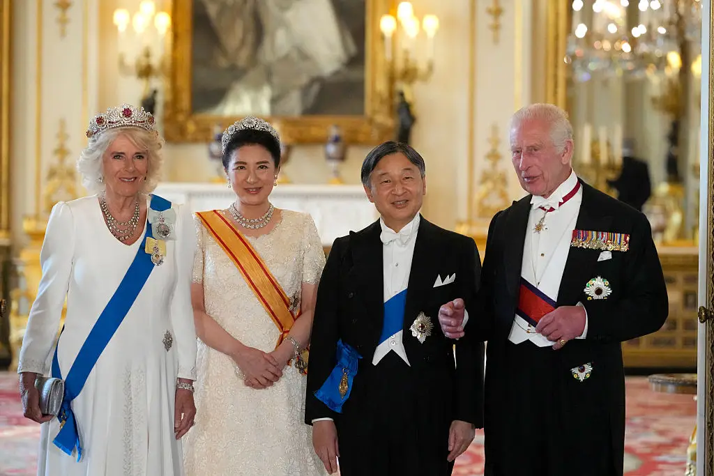 For the Japanese state banquet last year, she wore both family orders next to each other (KIRSTY WIGGLESWORTH/Getty Images) 
