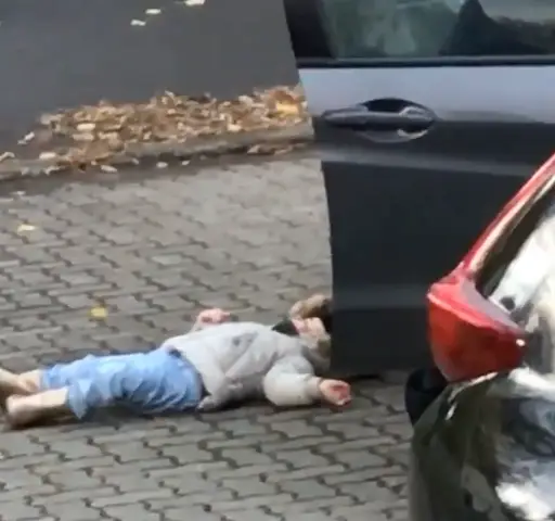 This toddler was not prepared to go for a walk.