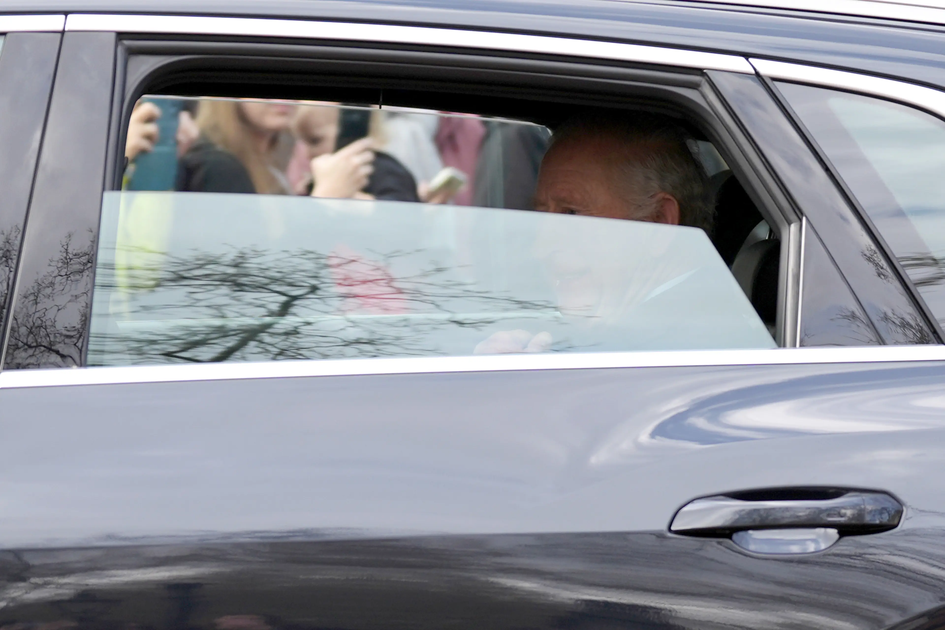 Charles smiled and waved at well-wishers as he left Clarence House in London in a black Audi on Friday morning (28 March) (PA)