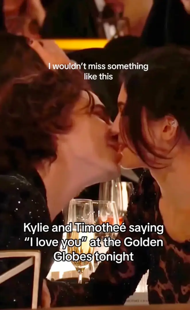 The couple were caught smooching several times.