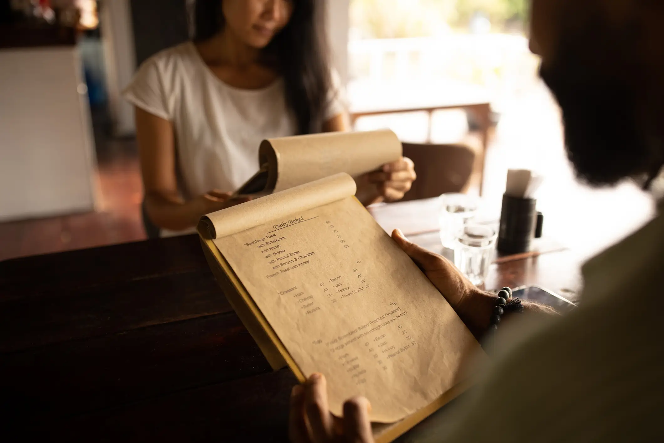 Be wary about one specific part of any restaurant's menu. (miodrag ignjatovic / Getty Images)