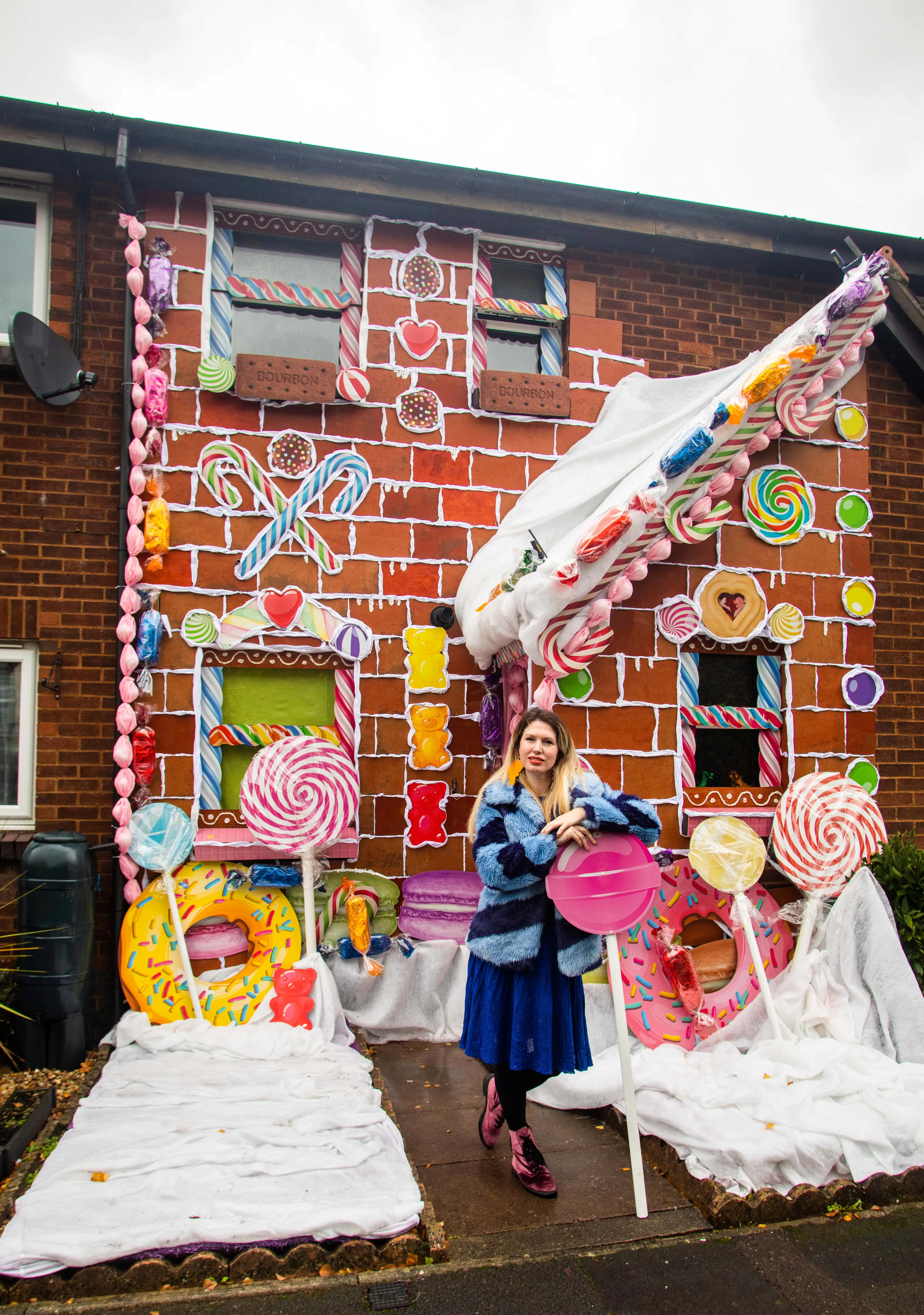 The house is complete with biscuit window frames, candy canes and gingerbread men.