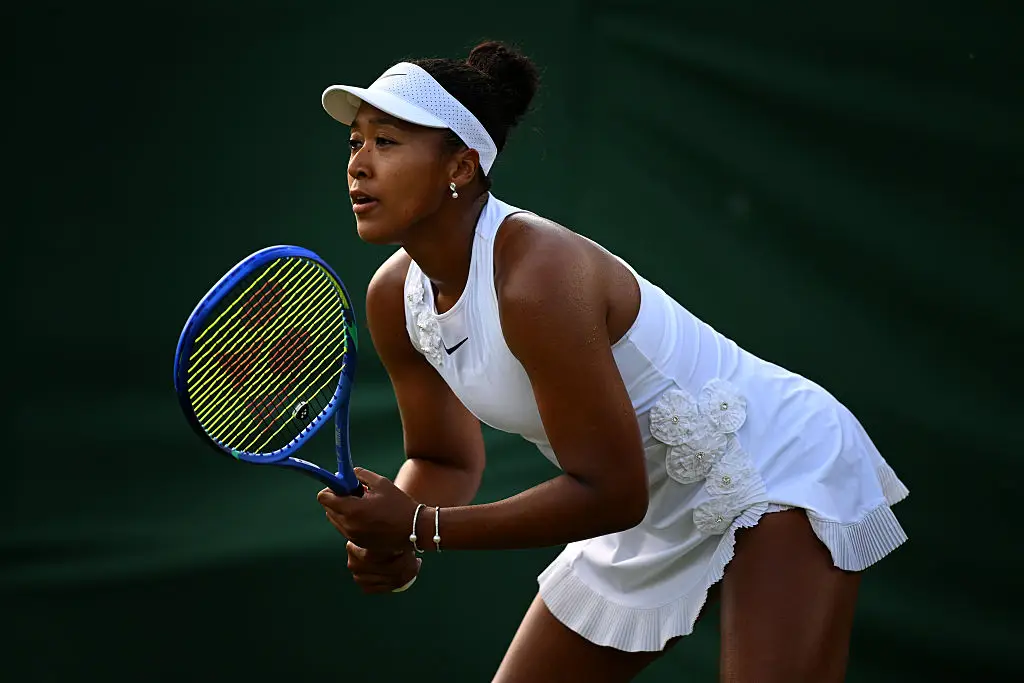 She removed the kimono dress to play the match in a more standard sports outfit - but still added her own bedazzled touch (Matthias Hangst/Getty Images)