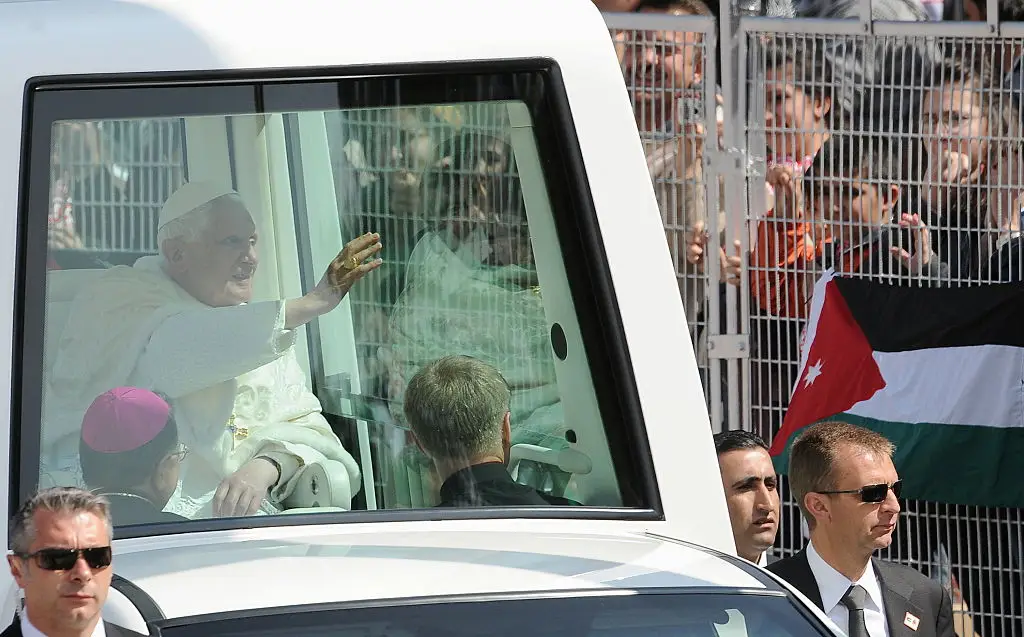 Pope Benedict XVI didn't fancy taking the risk and could be seen sealed off in the covered roof ( ALBERTO PIZZOLI/AFP via Getty Images)