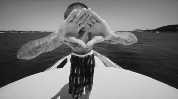 People claimed the hand signal was associated with the Illuminati (YouTube/Justin Bieber)