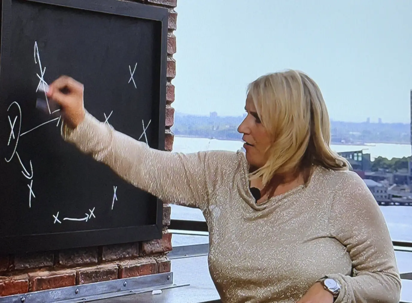 ITV is being slammed after making expert pundit Emma Hayes do a tactical analysis on a chalkboard from a 'kitchen' set (ITV)
