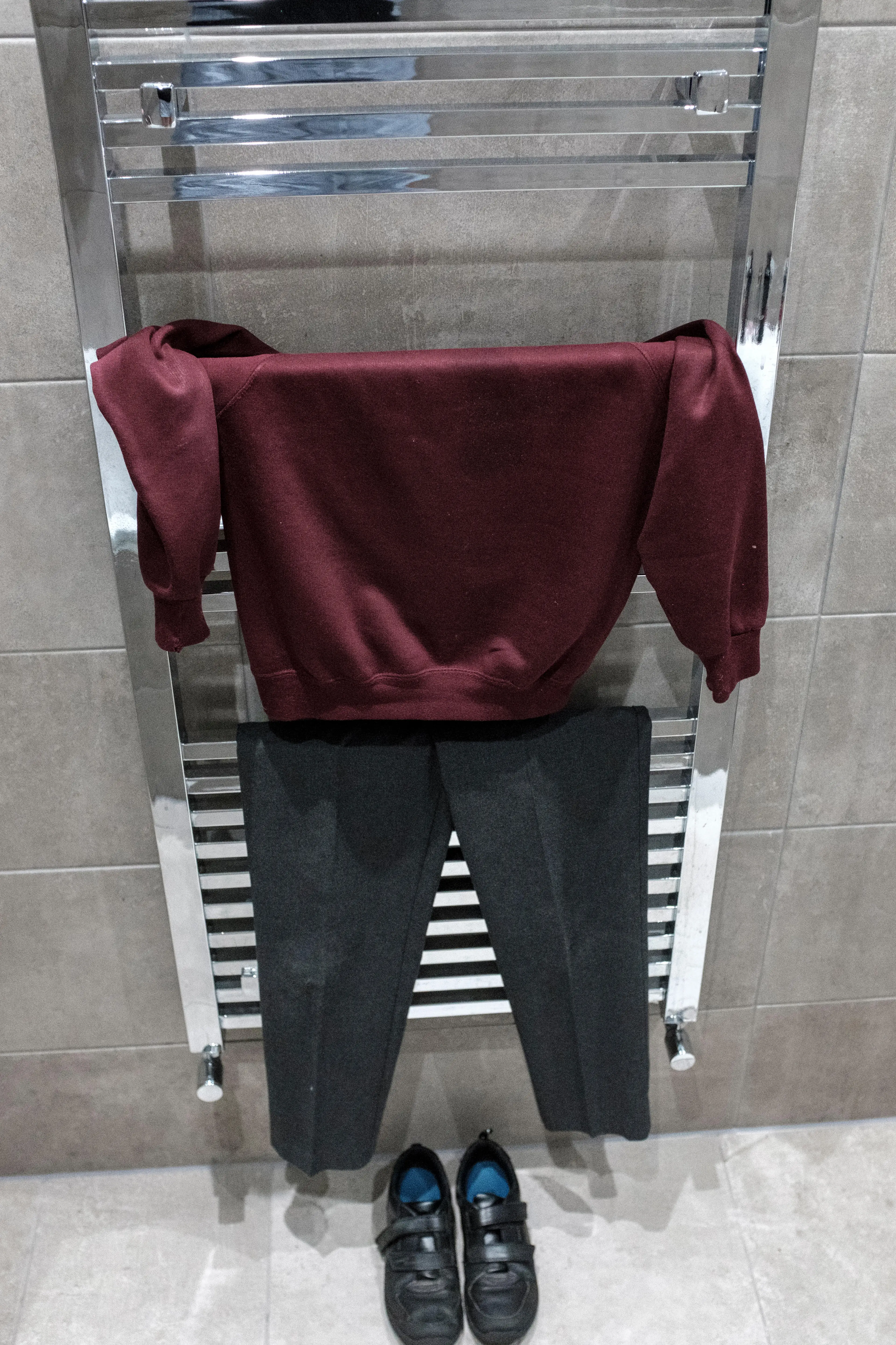 Make the most of shower steam to keep uniforms clean.