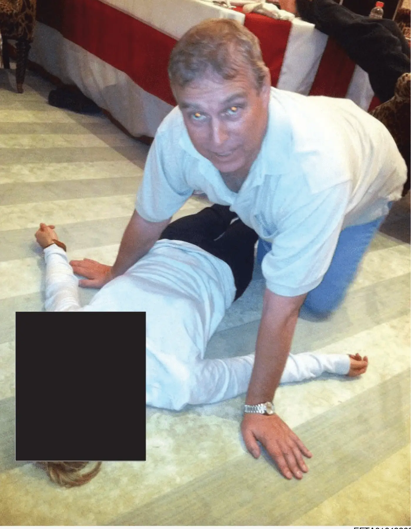 The photos show Andrew leaning over a woman on the floor (Department of Justice)