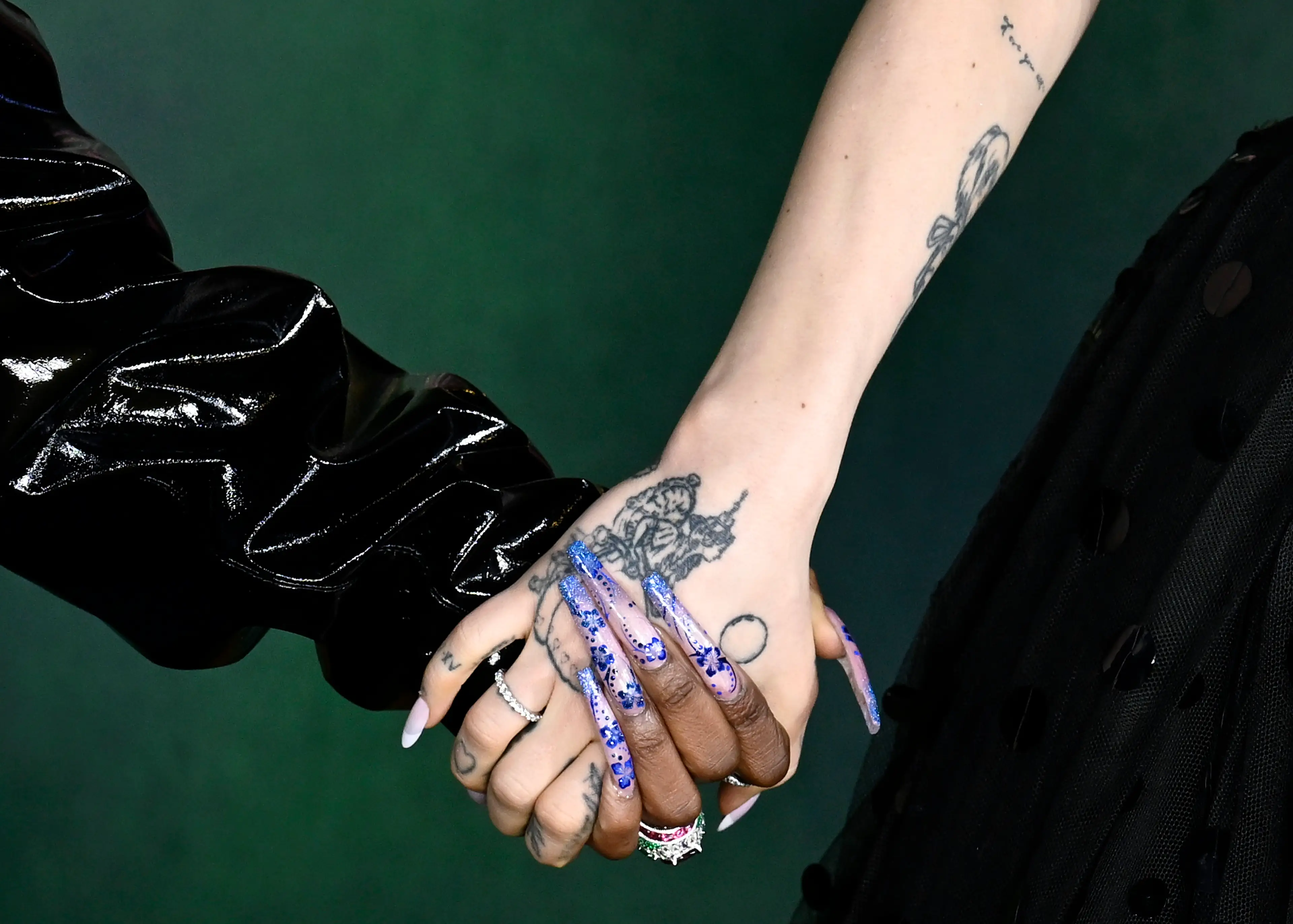 The duo are often seen holding hands during red carpet events, sparking relationship rumours (Gareth Cattermole/Getty Images)