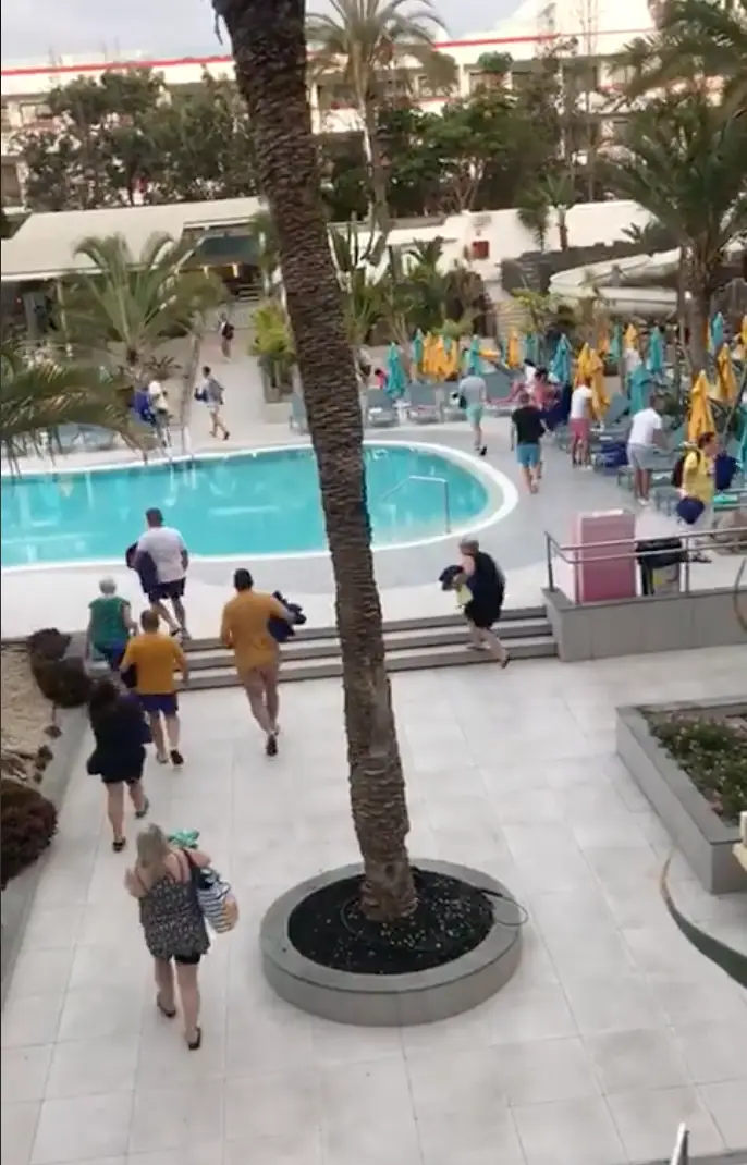 People ran to grab a sun lounger.