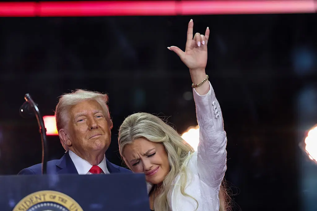 Erika Kirk held up a hand guesture signalling love (Win McNamee/Getty Images)