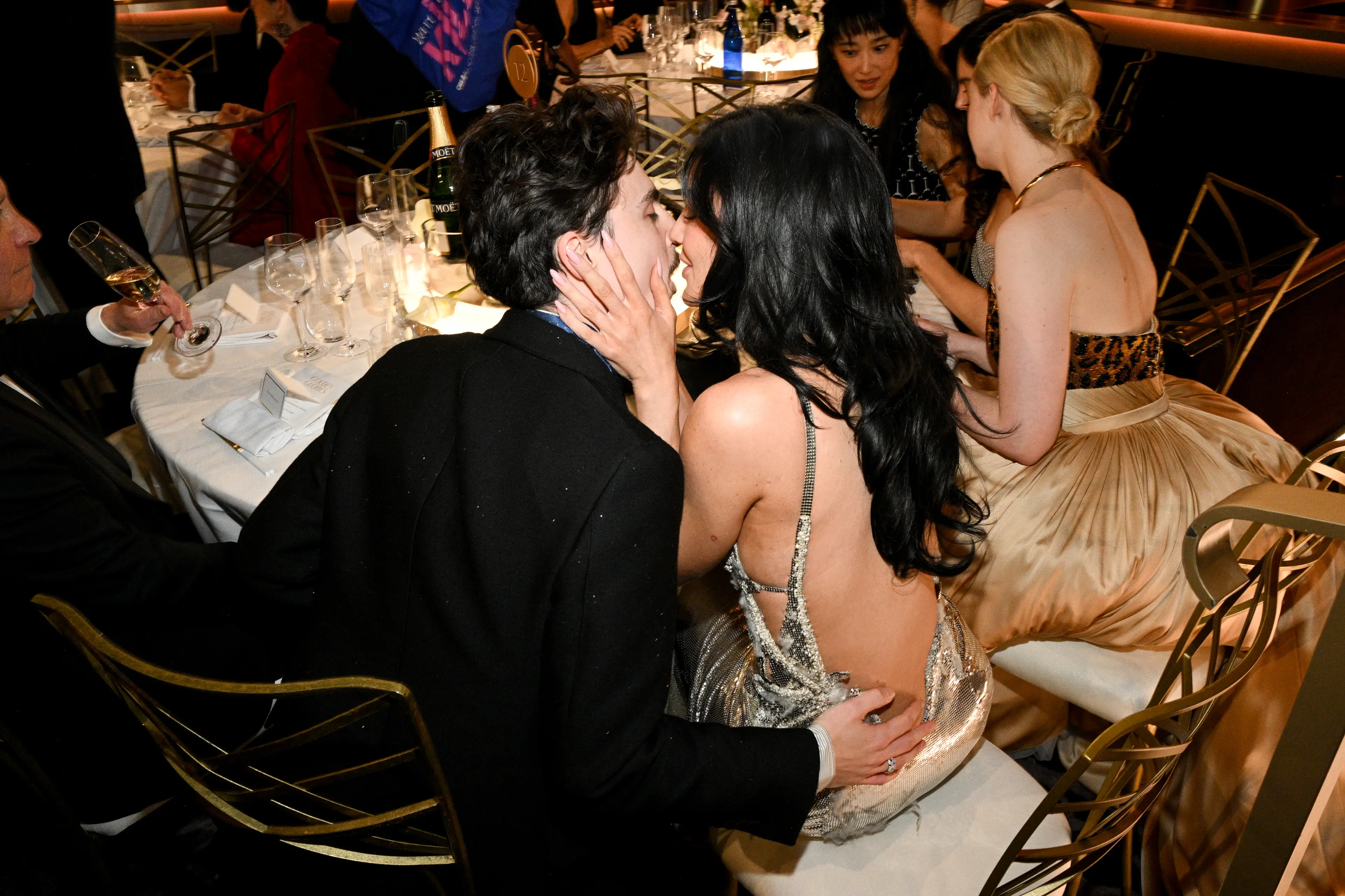 Tjhe couple weren't afraid to pack on the PDA (Michael Buckner/GG2025/Penske Media via Getty Images)