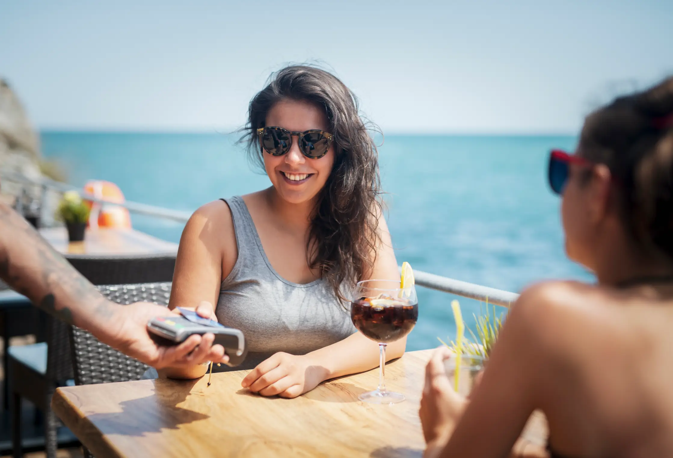 Paying abroad could cost you more if you make this mistake. (ArtistGNDphotography/Getty Images)