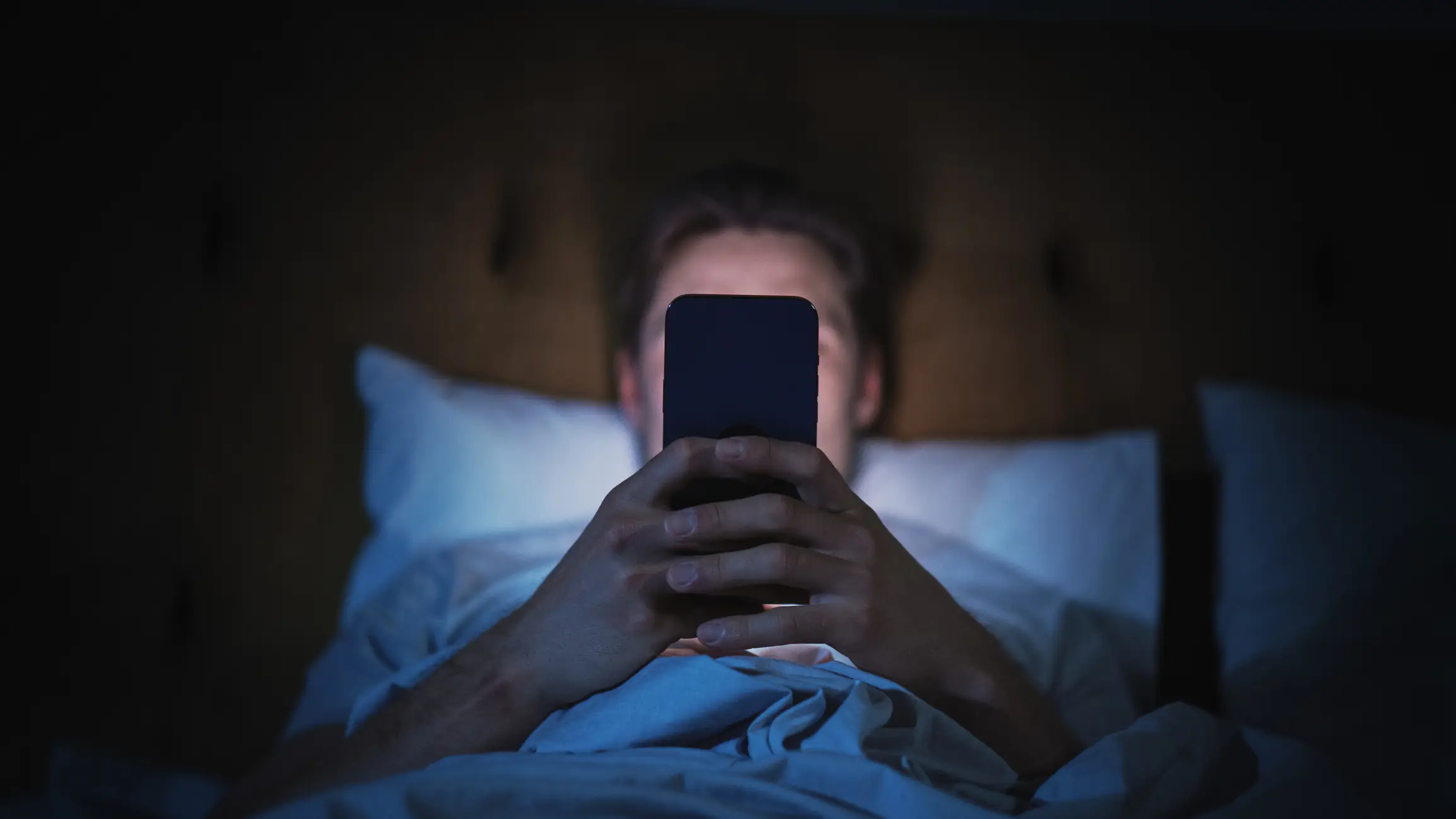 Late-night scrolling can steal hours your body needs to recover (gorodenkoff/Getty Images)