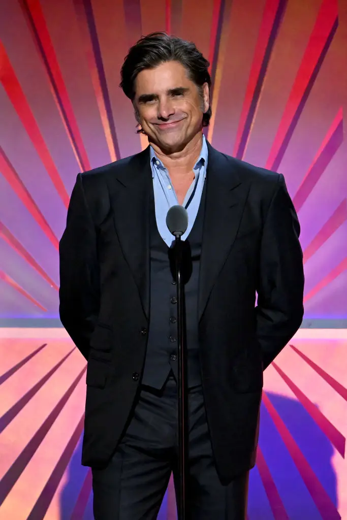 John Stamos shared an explanation about his attendance at the event (Michael Kovac/Getty Images for AARP)