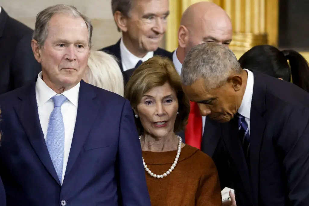 A lip reader has revealed what Obama allegedly said to Bush during the ceremony (SHAWN THEW / Contributor / Getty Images)