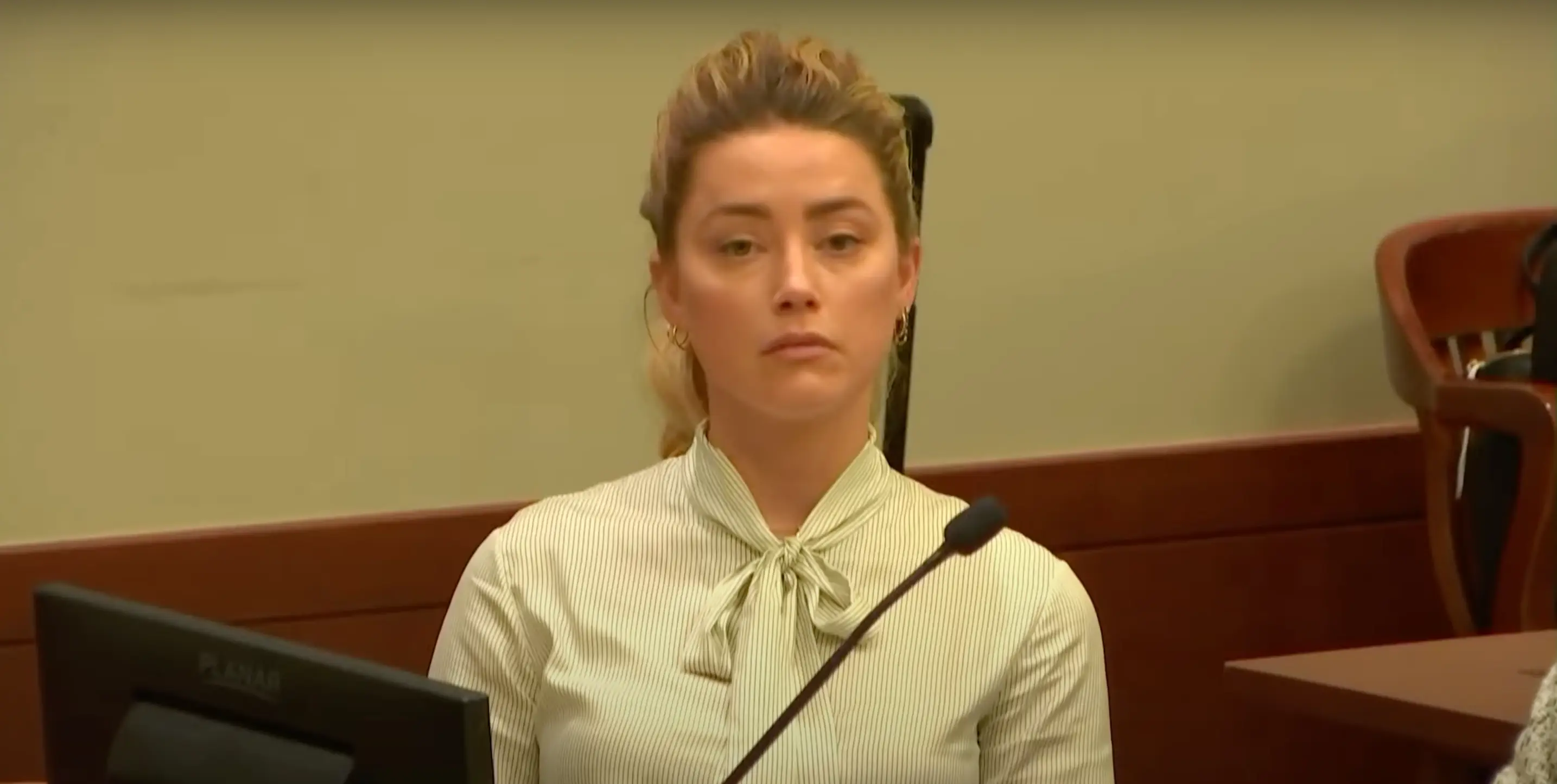 Amber Heard maintained eye contact with Johnny Depp. (