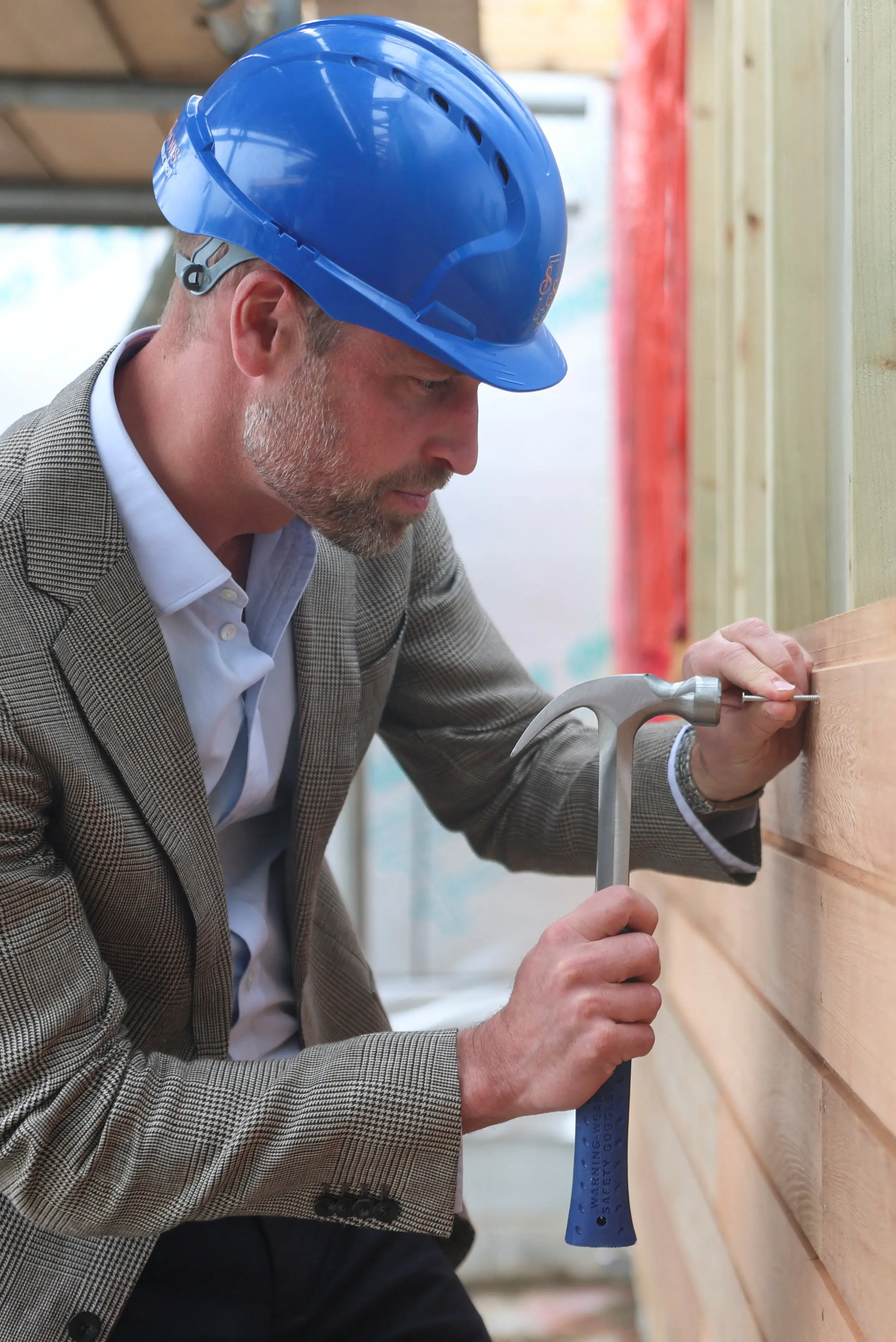 Prince William has been defended after a photo of him hammering a nail during his recent St Mary's visit went viral (Hannah McKay-WPA Pool/Getty Image)