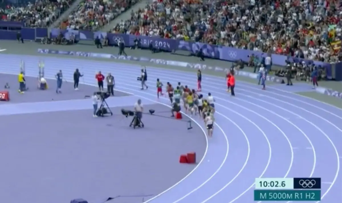 A cameraman wandered into the men's 1500m heat. (BBC)