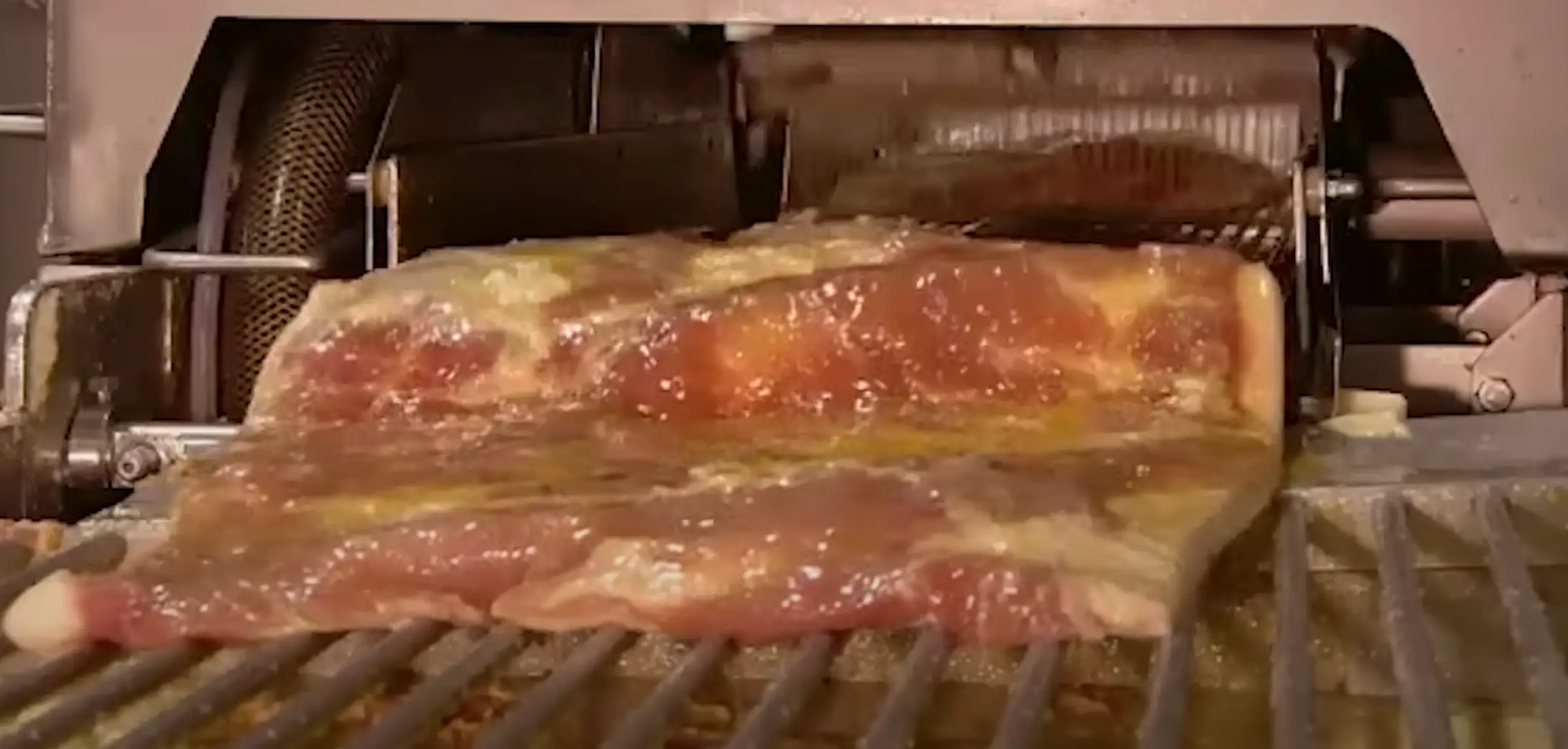 The pork bellies take a right battering in the factory (Discovery)