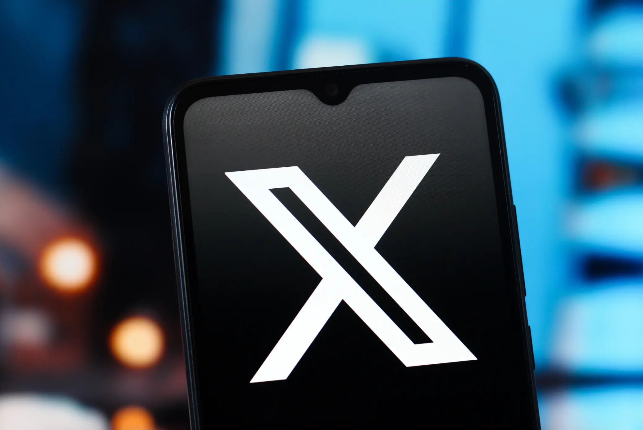 Elon Musk's X AI chatbot, Grok, has been used to create and share sexualised images of women and children (Photo Illustration by Thomas Fuller/SOPA Images/LightRocket via Getty Images)