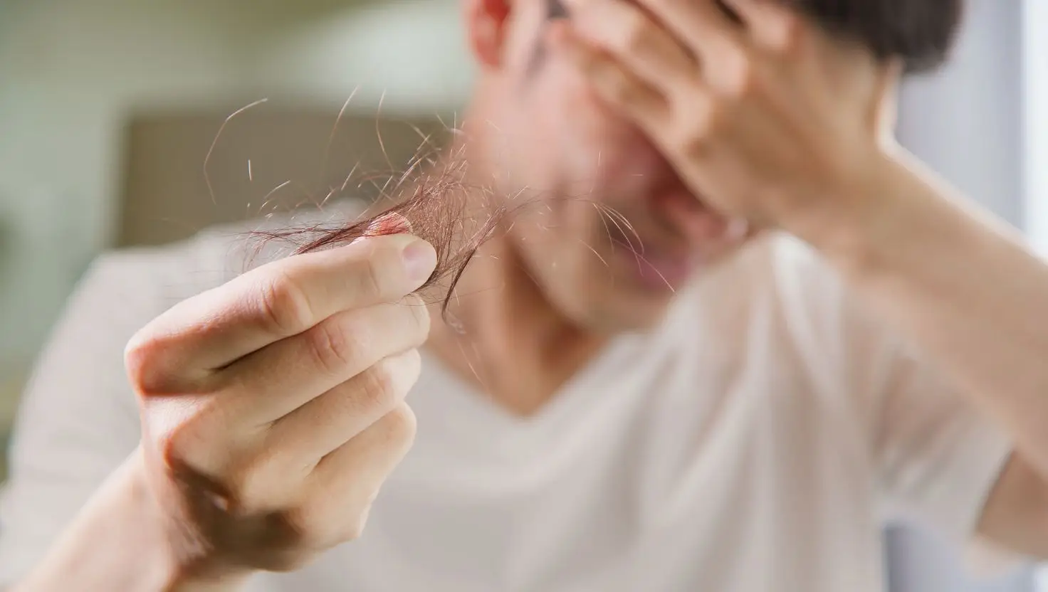 Dermatologists can employ something known as the 'hair pull' method to figure out if you'll go bald (Getty Stock Images)