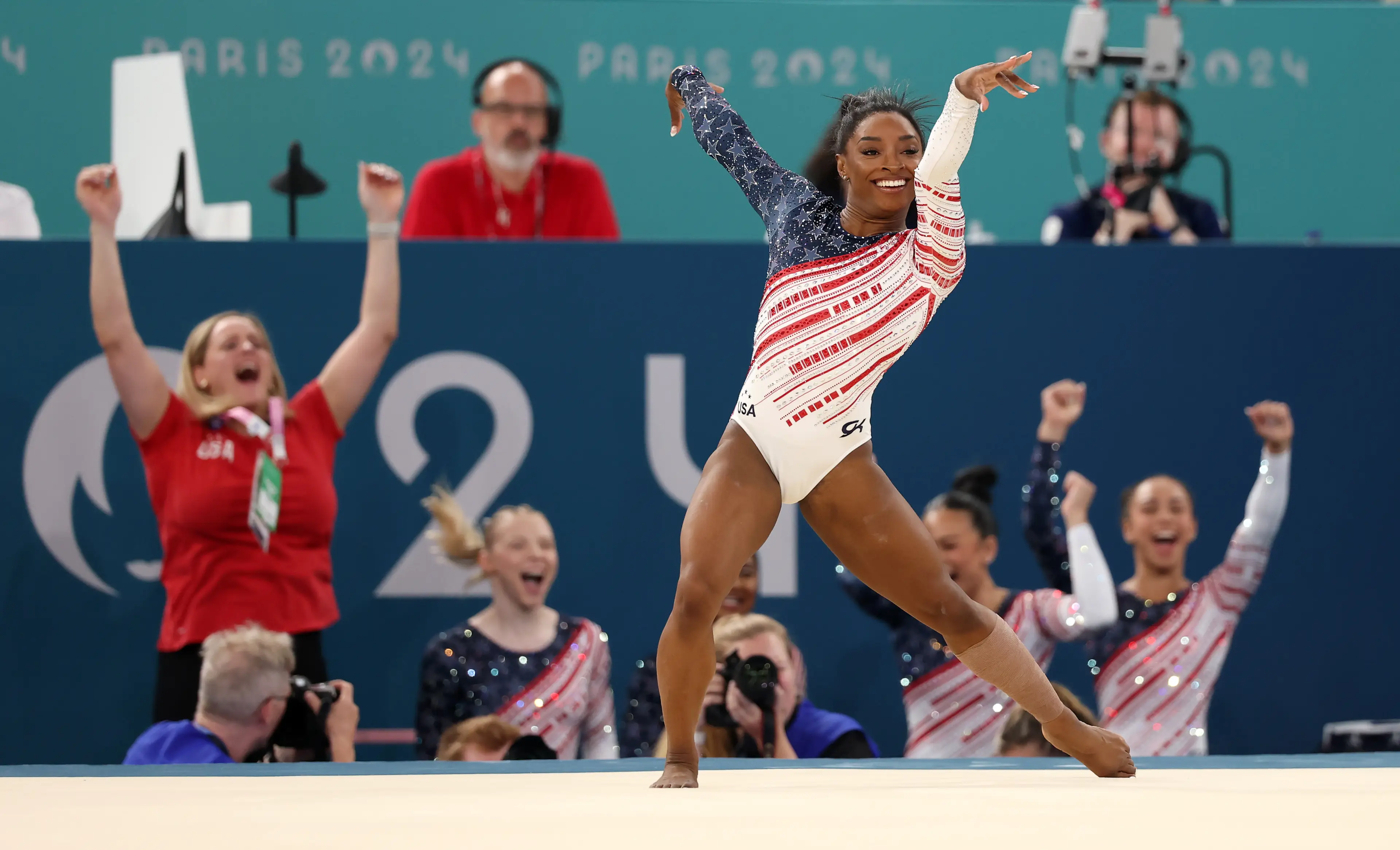Gymnastics is a famously smiley Olympic sport. (Jamie Squire/Getty Images)