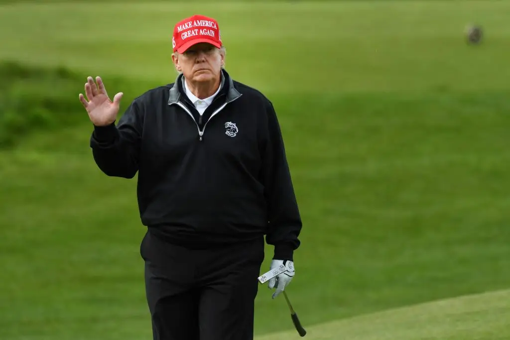Trump is known for his love of golf and owns courses around the world (ANDY BUCHANAN / Getty Images)