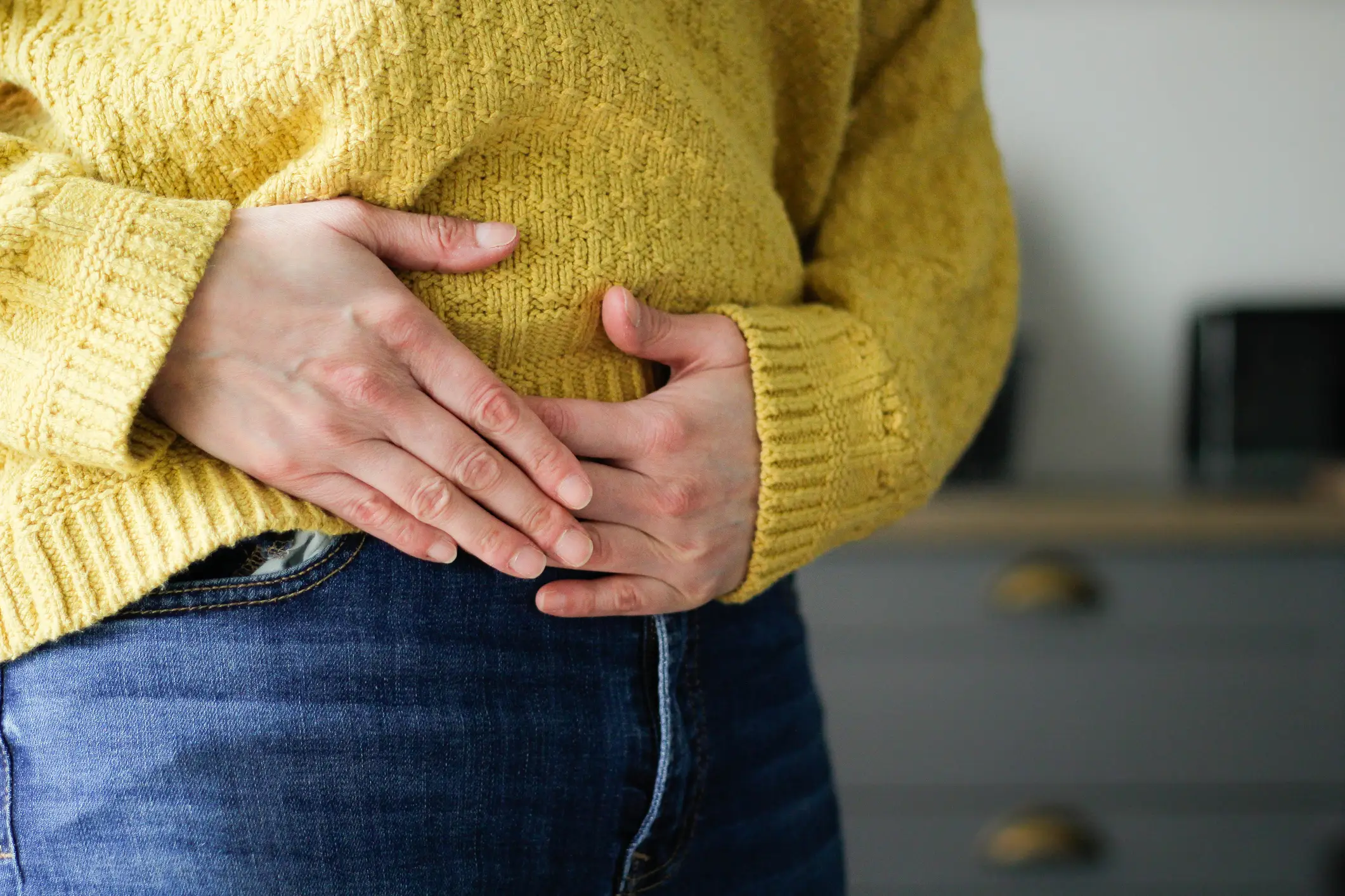 Tummy and upper thigh pain are also symptoms to look out for (Getty Stock Image)