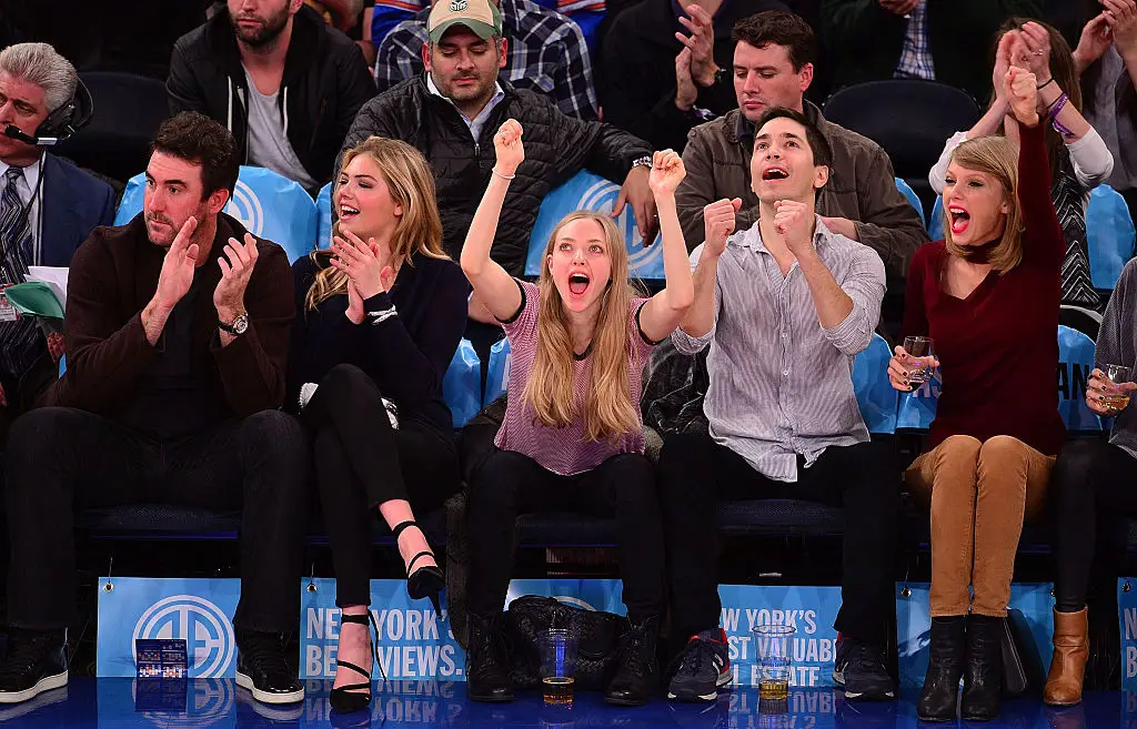Swift attending a 2014 Knicks game with Amanda Seyfried (Alex Goodlett/Getty Images)