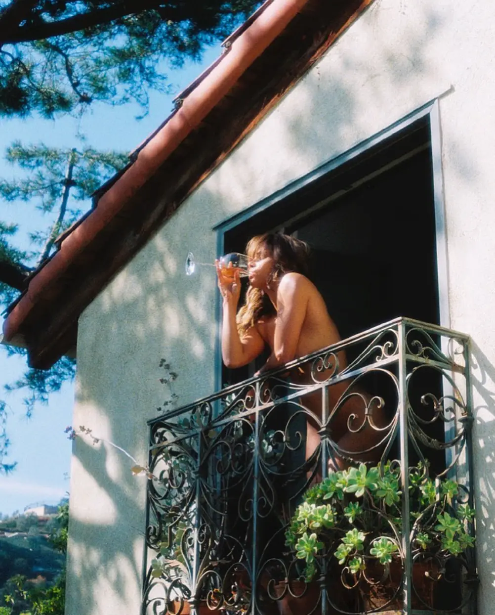 Halle Berry posted a naked photograph of herself drinking wine on a balcony on social media.
