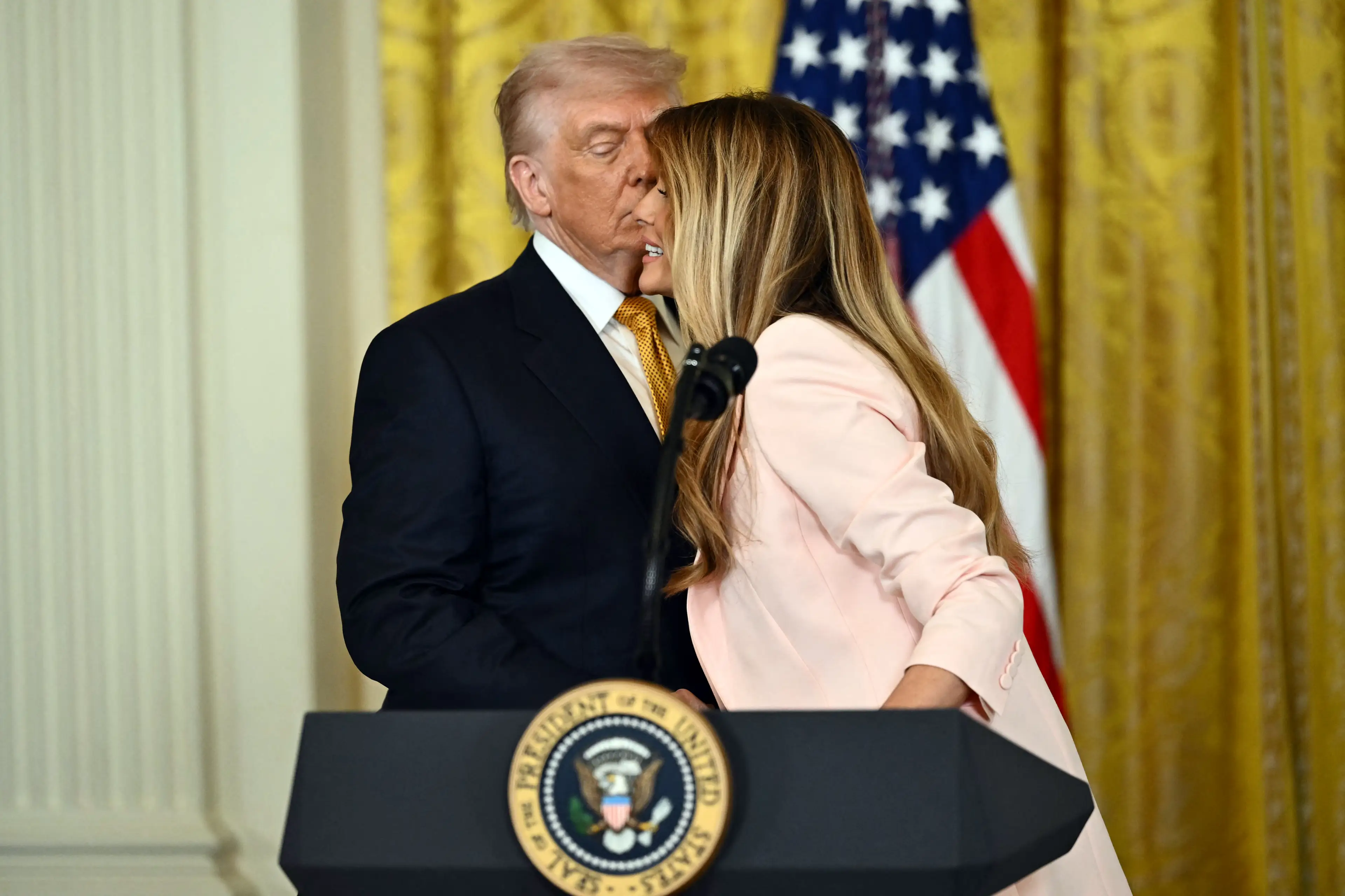 A lip reader has alleged Melania Trump had some stern words for her husband (NISHIMURA / AFP via Getty Images)