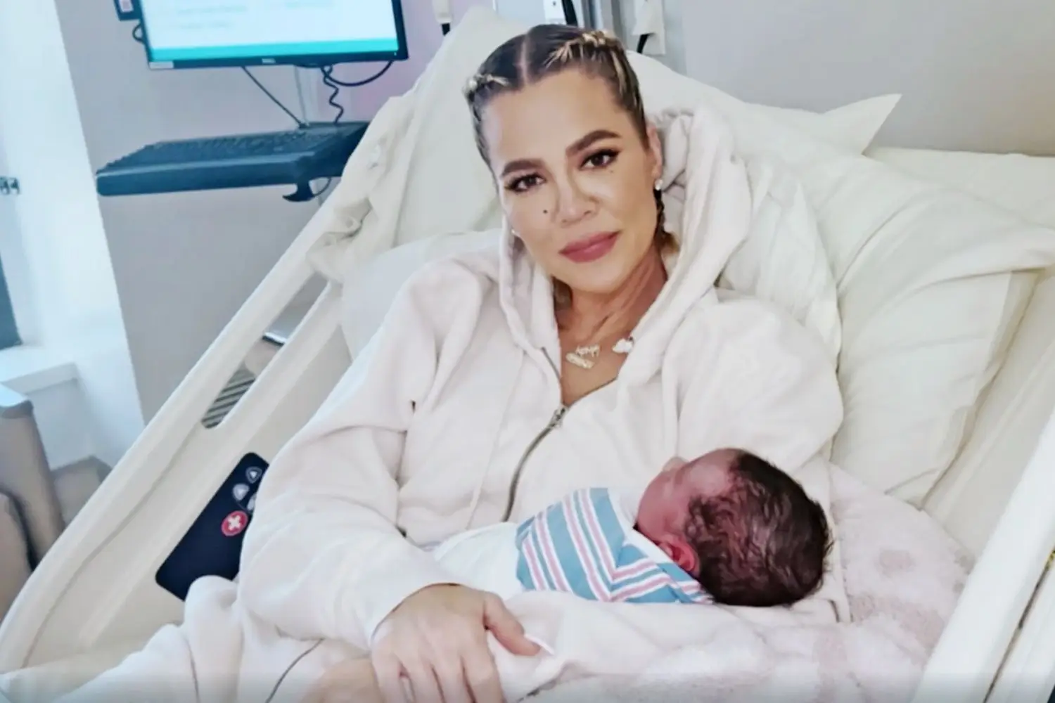 Khloé Kardashian holding her son Tatum (Disney+)