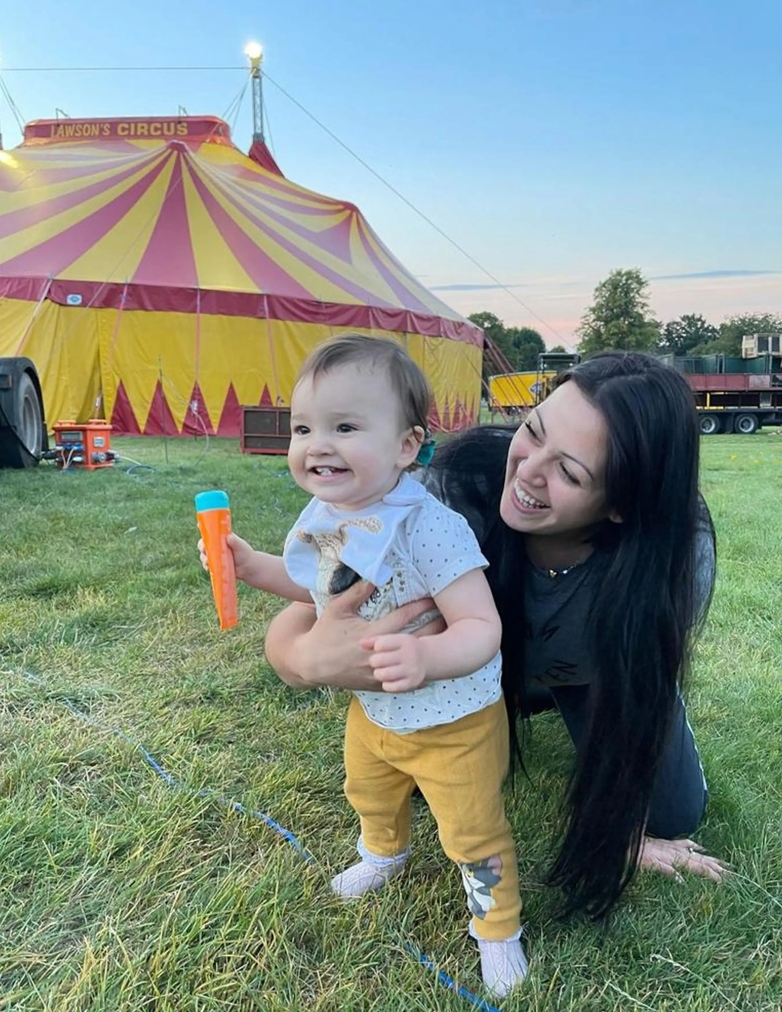 A professional hula hooper has been 'mum-shamed' for raising her daughter in the circus.