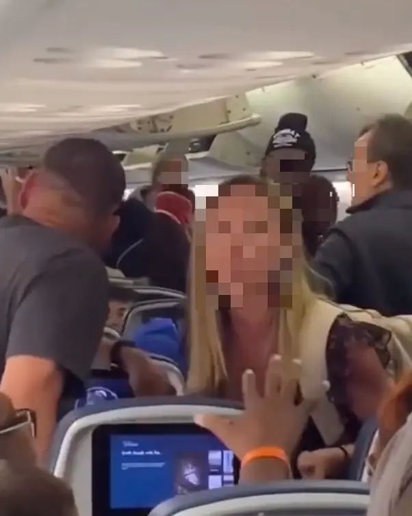 The woman accused the passenger behind her of repeatedly kicking her seat when she reclined it.