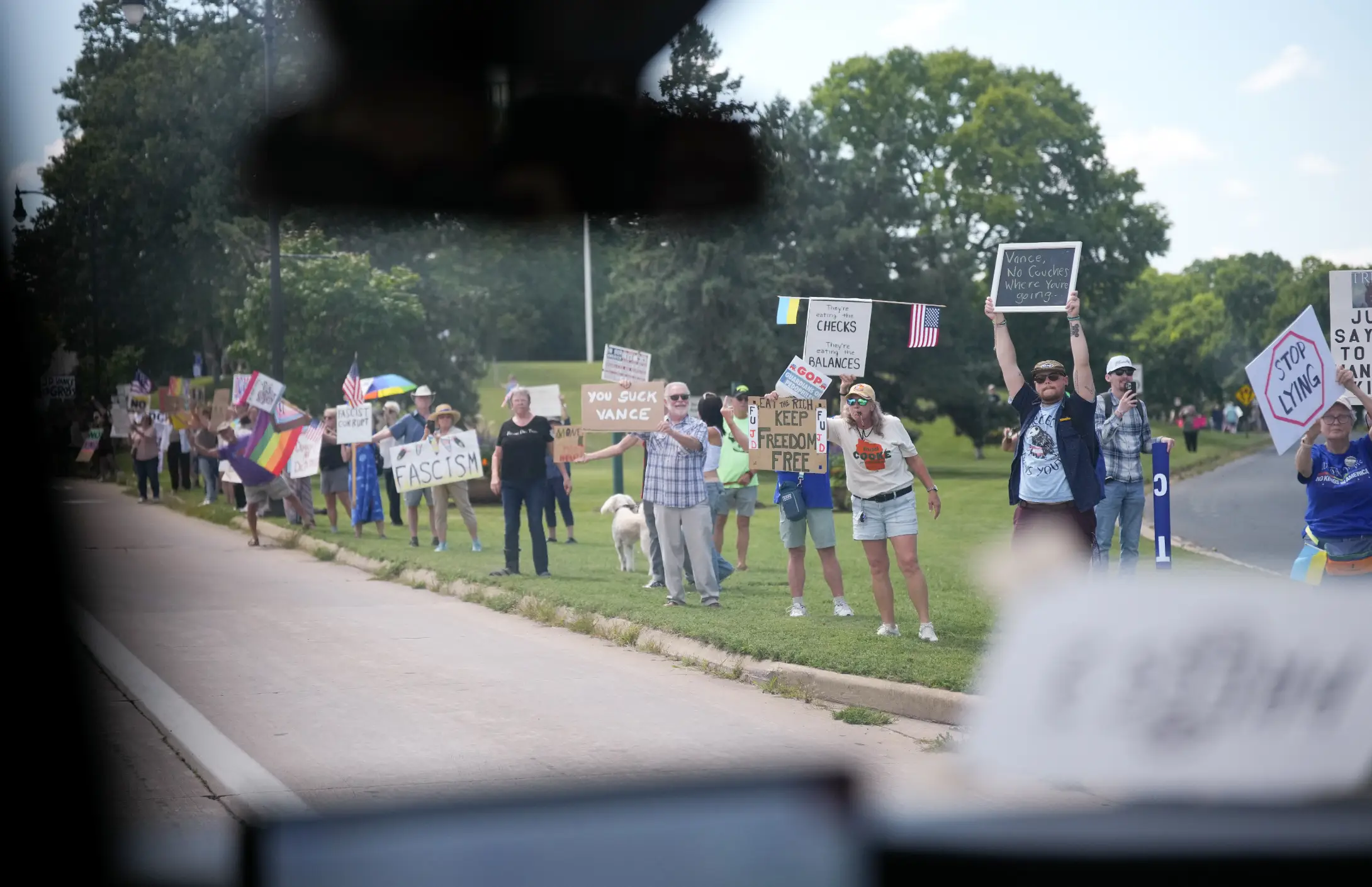 Protestors lined the road as they waited for Vance to drive past (Andrew Harnik/Getty Images)