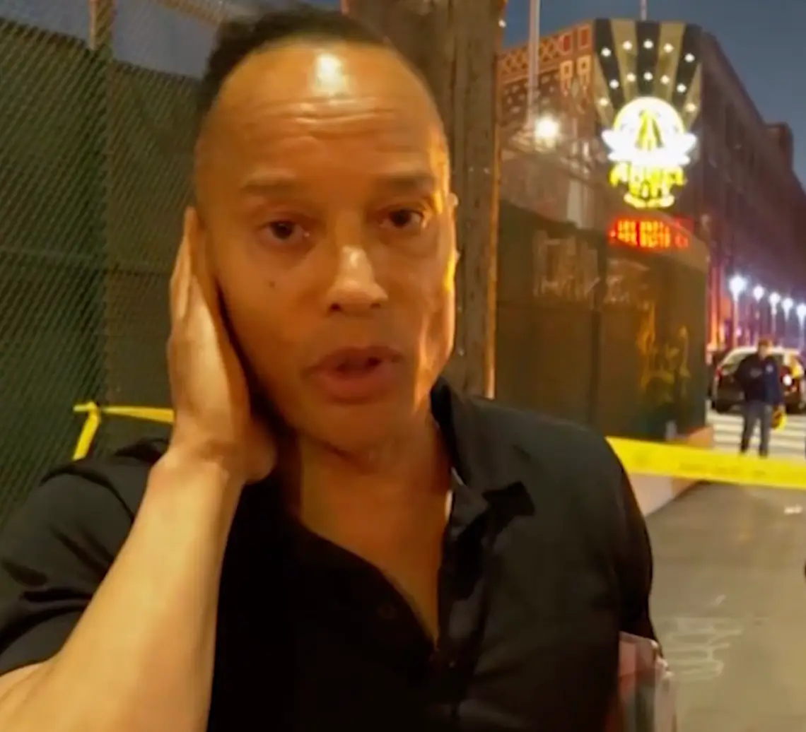 Carroll was escorted away from the protest area by LAPD (CNN)