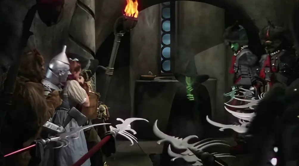 Wicked begins with the townspeople celebrating the Wicked Witch's death (Warner Bros)