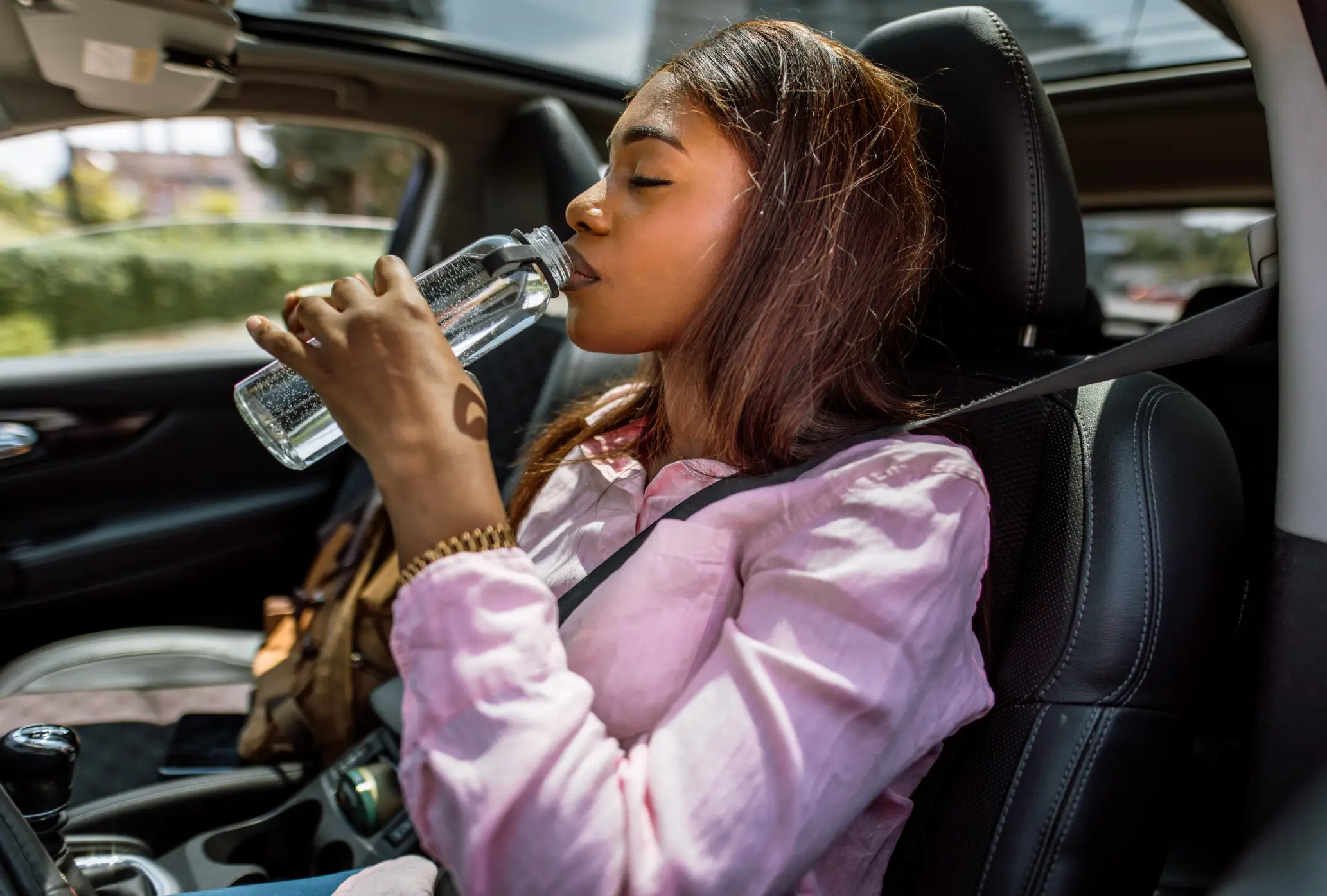 You may want to think twice before drinking a newly-discovered bottle of water that's been sitting in your car for ages (Getty Stock Images)