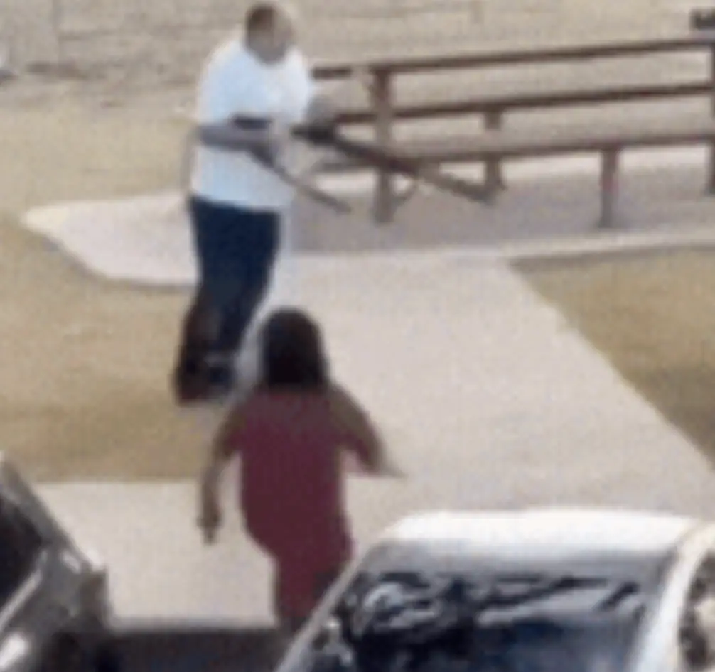 The hero wearing a red T-shirt in the viral Bondi Beach shooting footage has been identified (GoFundMe)