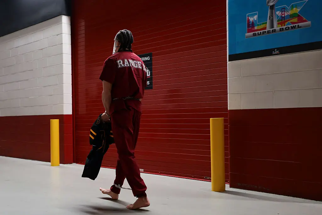 Hollins regularly goes barefoot and wears quirky costumes ahead of games (Kathryn Riley / Contributor / Getty Images)