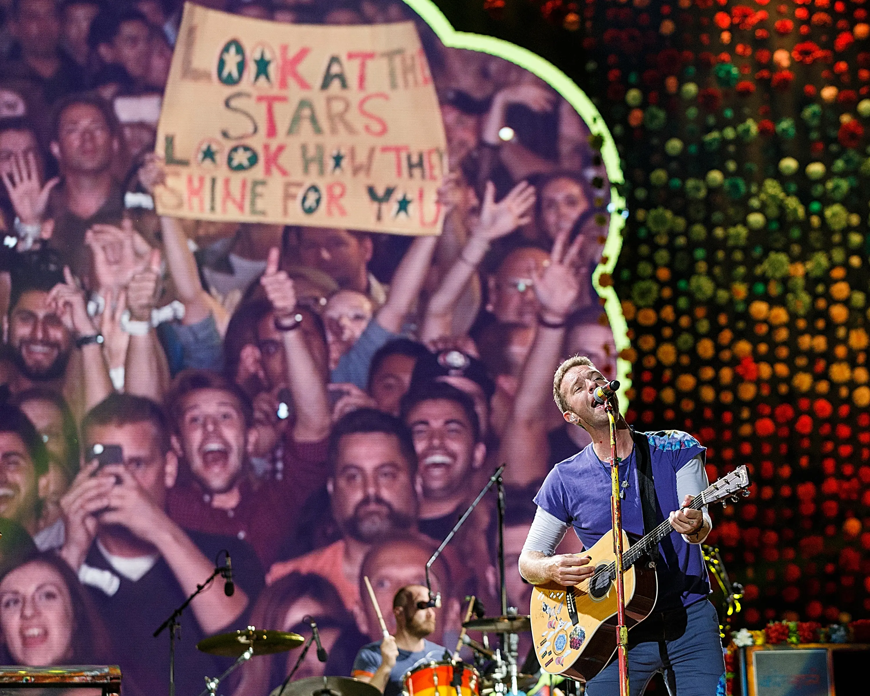 The band's current world tour features a giant jumbotron screen, where they focus on couples in the crowd (Andrew Chin/Getty Images)