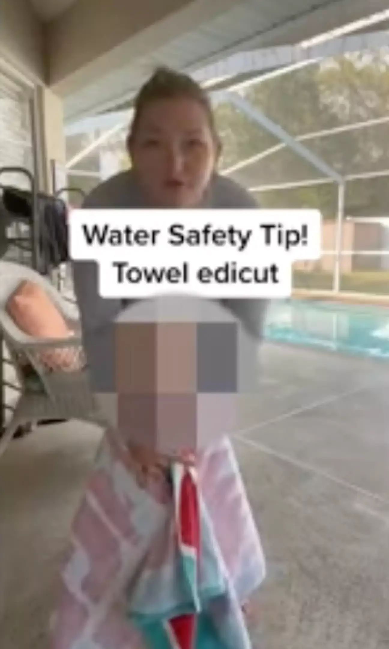 It's safer to put the towel underneath the child's arms.