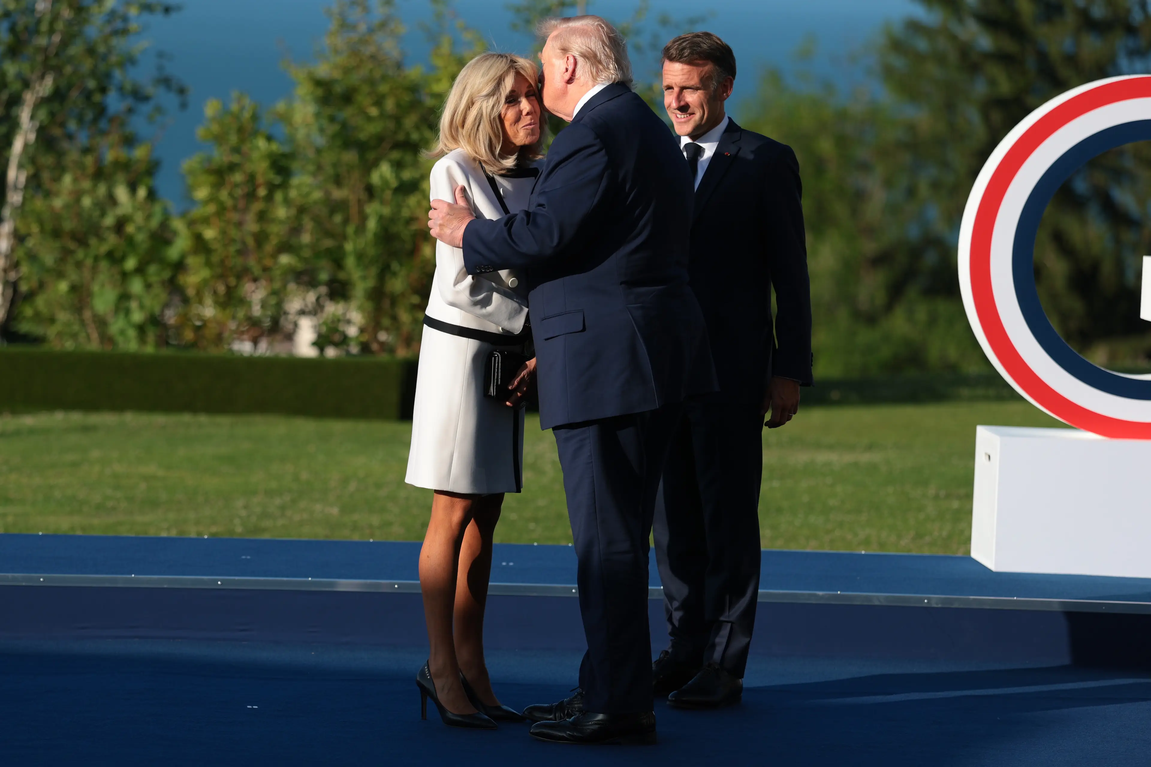 Trump held the French First Lady close (Anna Moneymaker/Getty Images)