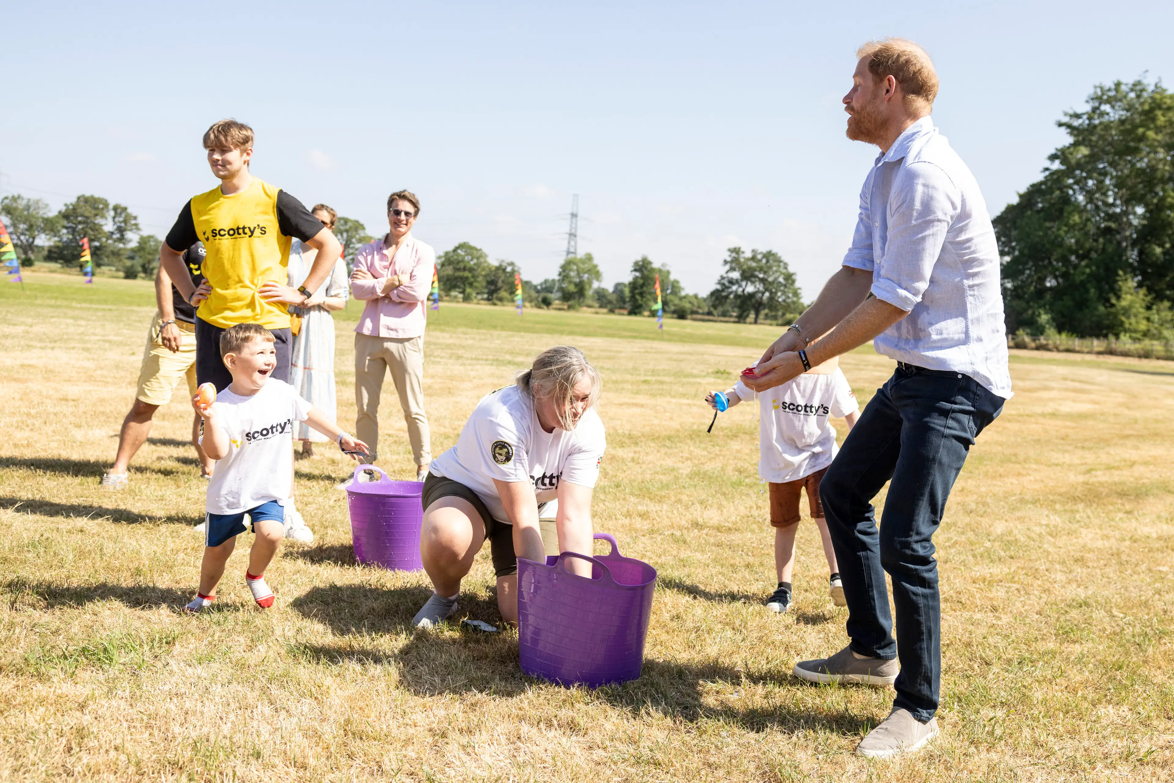 Harry later joined in on a water balloon fight (Heathcliff O'Malley-Pool/Getty Images)