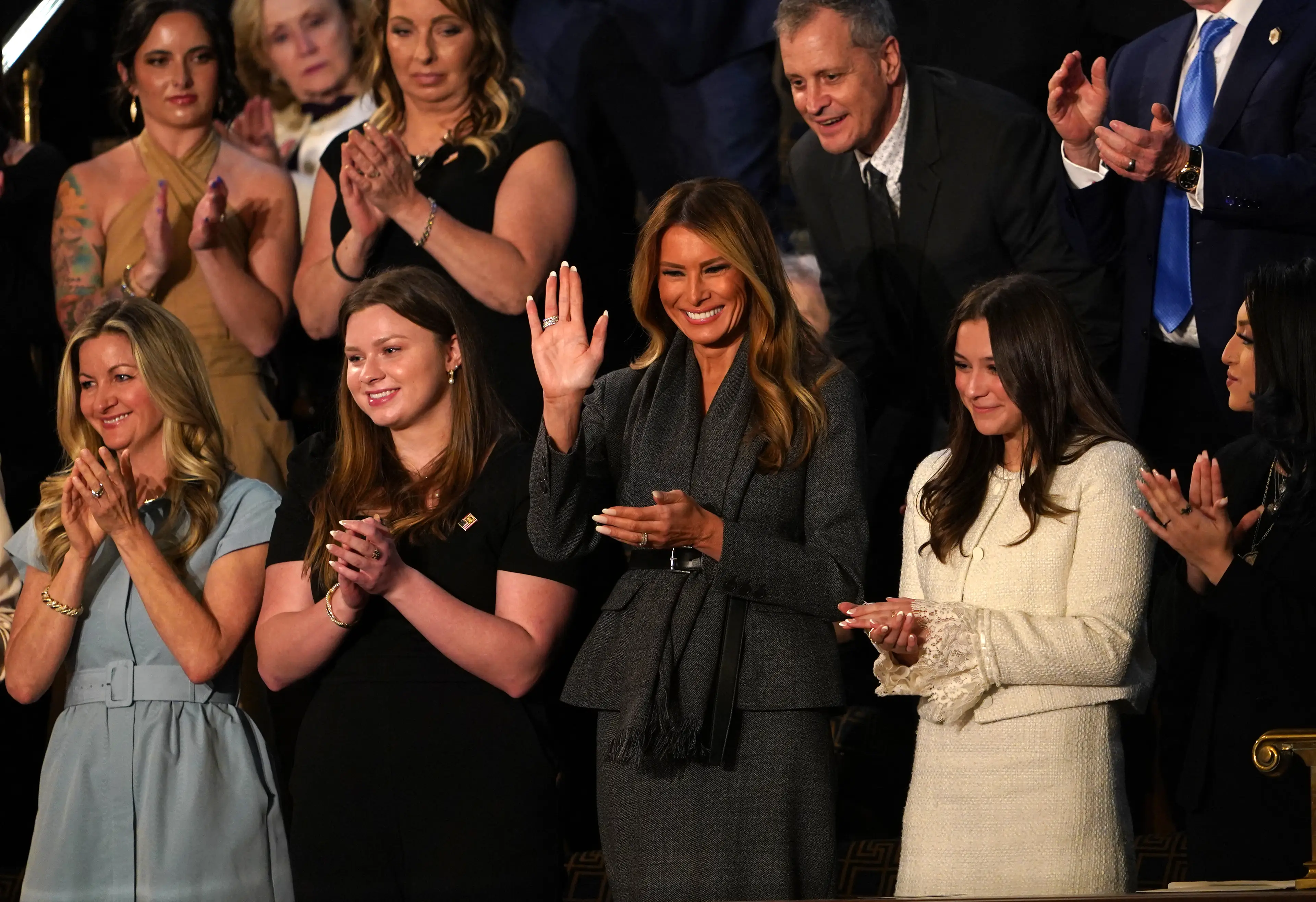 Melania stood when Trump gave her a shoutout (ALLISON ROBBERT/AFP via Getty Images)