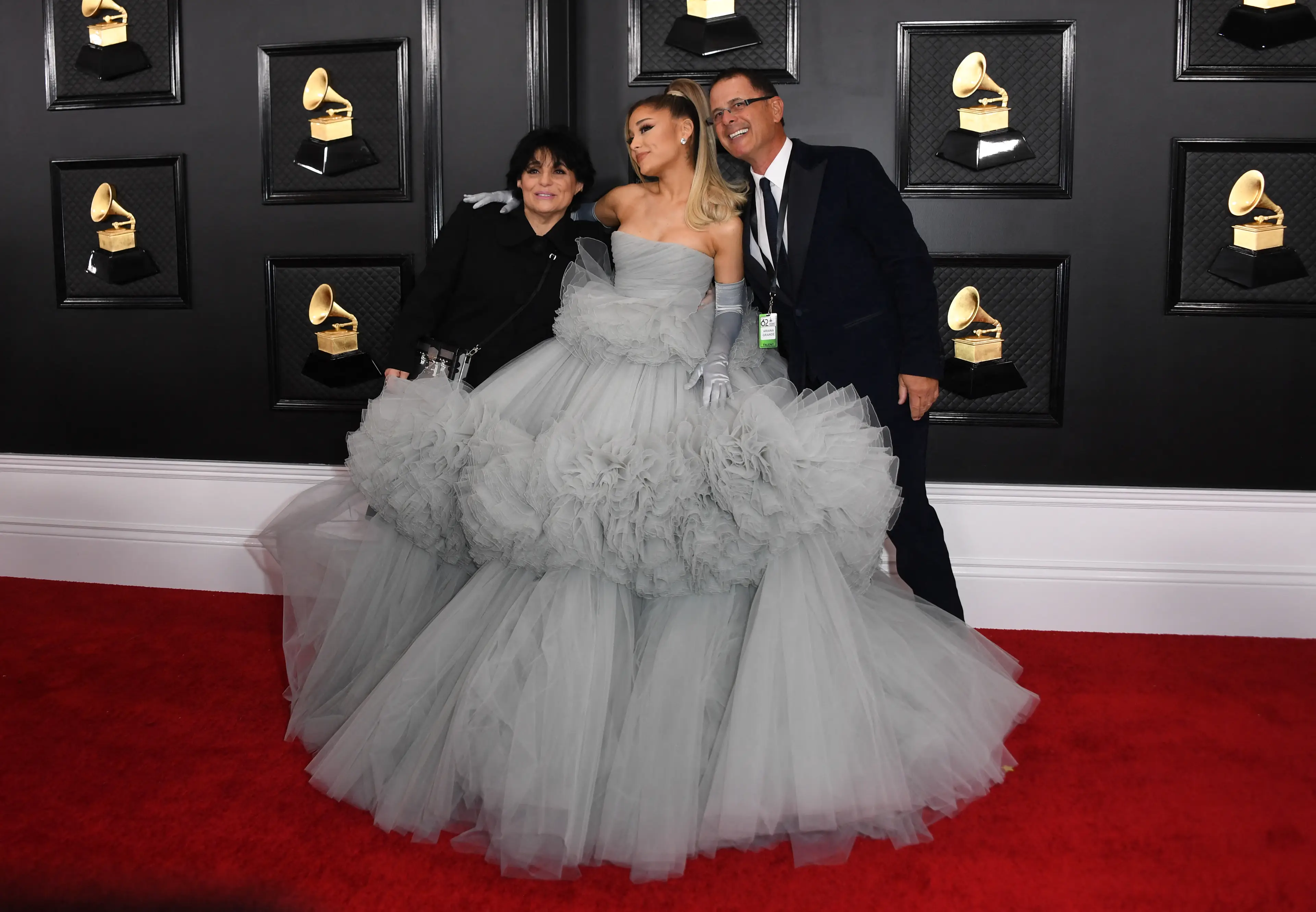 Ariana Grande with her parents Joan Grande and Edward Butera at the 2020 Grammys (VALERIE MACON / AFP)