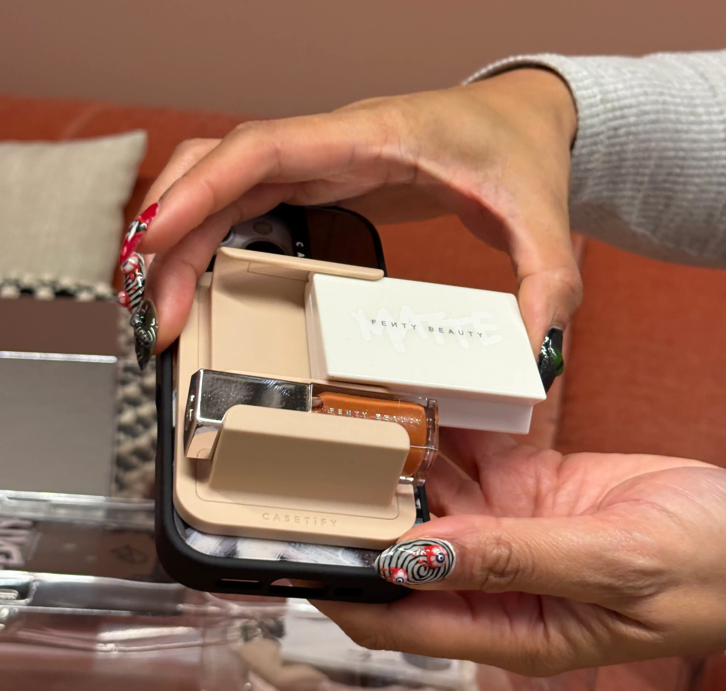 The phone socket easily snaps onto the Fenty Beauty mirrored case
