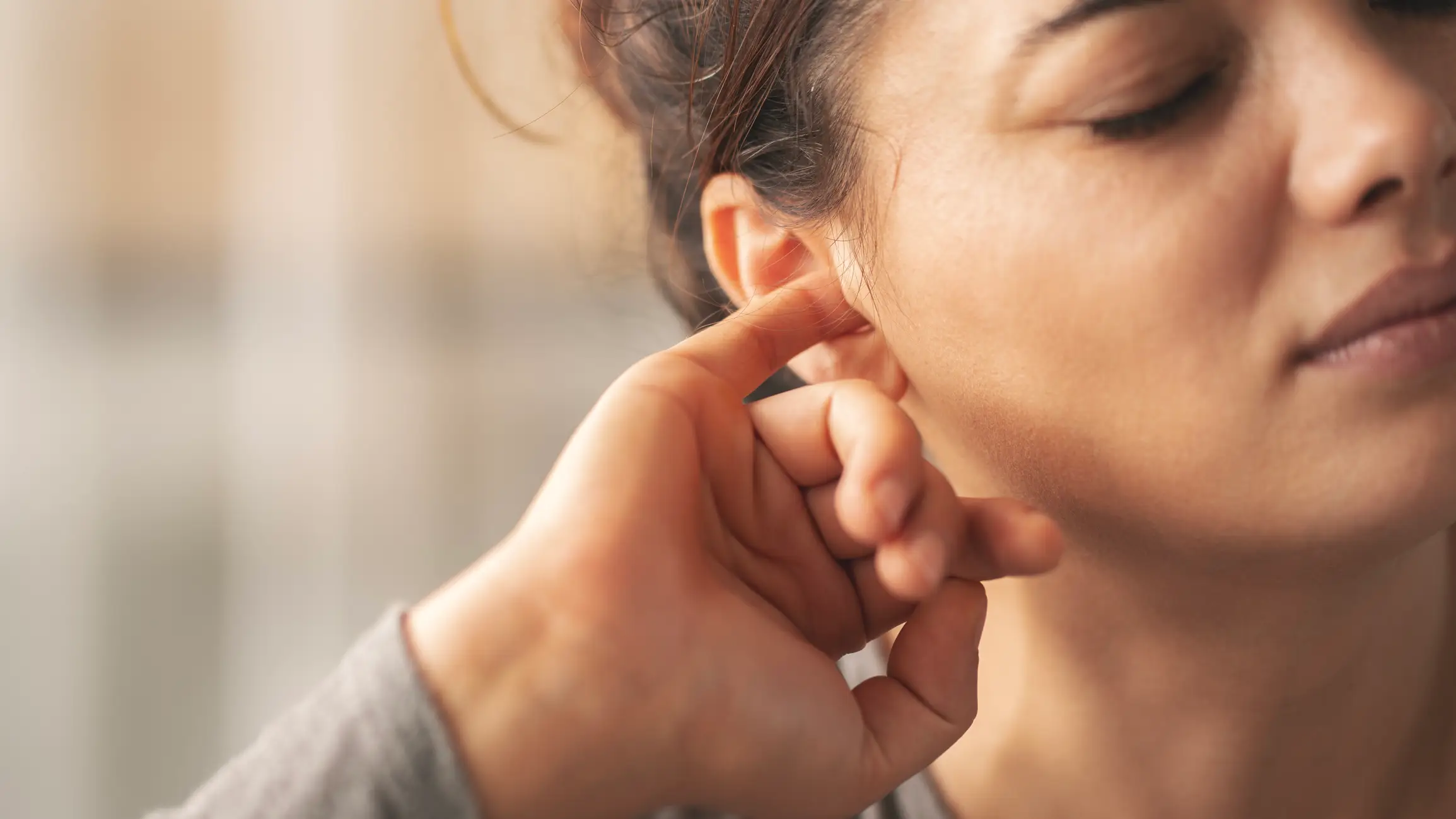 A women's health expert has explained the 'perimenopause ears' phenomenon (Getty Stock Images)