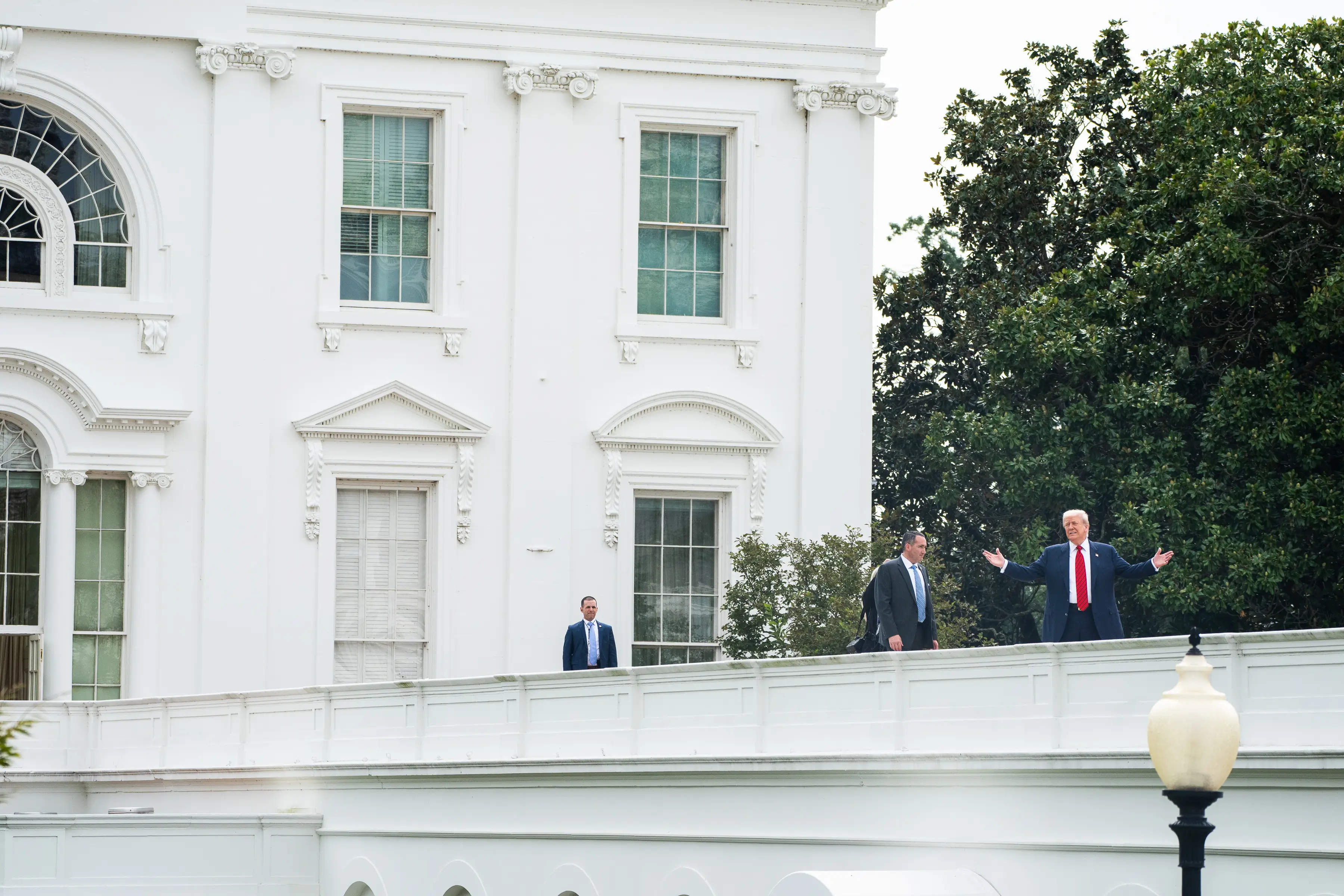 Donald Trump left reporters baffled after he was seen 'taking a little walk' on the White House roof on Tuesday (5 August) (Demetrius Freeman/The Washington Post via Getty Images)